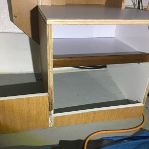 I put a backing plate in the back of the middle shelf to hide the wires and prevent stuff from falling in the back.