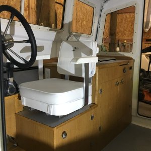 Helm chair will spin 360 degrees and can move fore and aft as needed for comfort.