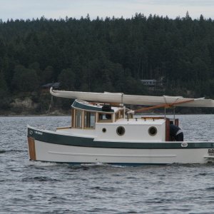 Media 'A Home built, and really cute, tug at Sequim Bay State Park, with a kayak wrapped on top.' in album 'Not the smallest we have seen with 3 on board, but the most portable.'