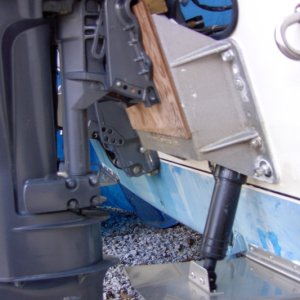 Media 'The wood 1x1 that elevates the engine gives a bit of clearance at the tab. The real purpose is because the two screw clamps that hold the kicker will hit the stern of the boat.' in album '"Mini Jacker" fixed kicker mount.  Allows the engine to sit a dab to the rear.Help with turning both directions and with the angle of the stern to keep the prop out of the water while running the main.'