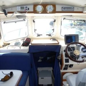 Cabin Interior fully lined with marine foam insulation and covered with marine vinyl.
All Storage lockers on board are also lined with 1/2" sheet foam insulation. 
I have no condensation collecting on the cabin liner or in the storage lockers. No need for fans on the forward windows.
The sheet foam in the storage lockers also gives cushion to all stowed articles and the boat is very quiet while running.