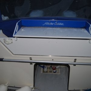 Transom board with rod holders and cutting table