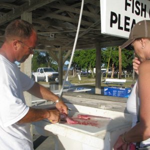 Jeff and Jo filleting the catch