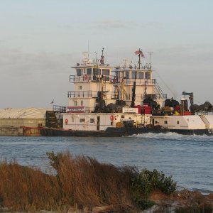 Six barges and two Tugs
