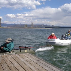 Jay arriving at Eagle Bay dock towing in couple in RIB who's motor had quit several miles out