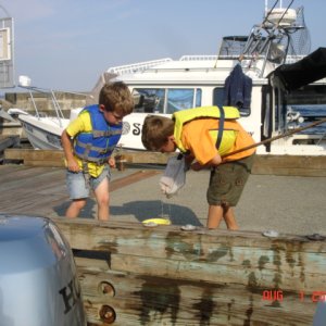 Griffin & Dominic checking their catch.