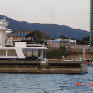 Bill 'HALCYON' at end of dock waving goodbye