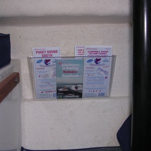 Magazine rack under dinnette.  It\'s a plastic document holder from Office Depot.  The kind that offices attach to office doors.