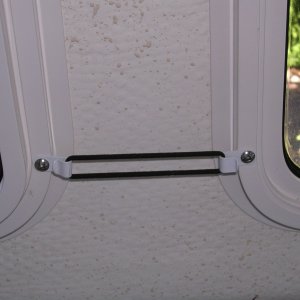 Small hair scrunchi used to hold curtains against cabin wall.