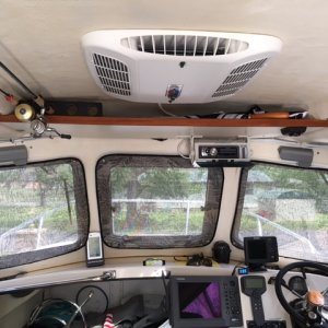Added Coleman Mach 8 Cub 9300btu to ceiling. Chose forward location for roof strength and air flow across windshield