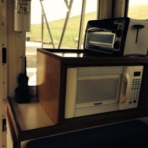 Media 'Starboard aft Microwave/ Toaster Oven shelf
+ handheld VHF and fire extinguisher' in album 'Boat on trailer full cockpit enclosure'