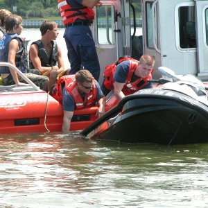 Media 'USCG Station Little Creek responds. Within minutes of this pix, CG receives emergency call- transferring the 4 teens to Sea Angel before Va. Beach Fireboat #1 arrives.' in album 'Sea Angel comes across 4 teenagers with a tow line around the drive assy.
The water temperature was 80 degrees F.'