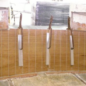 this is the first layer of wood in place, filled the grooves with thickened west system, epoxy resin, next comes three layers of glass and the next piece of wood, then glass over the top of all of it to make it complete