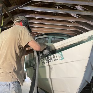 Media 'Gelcoat spider crack removal. What a nightmare to repair, or so I thought until I consulted with Andy of Boatworks Today. He convinced me to just abandon the gelcoat and completely sand it off wherever there was spider cracking, put new fiberglass over those areas, and then paint the boat with a high quality marine exterior paint like Alexseal. So the sanding begins...' in album 'Rub rail removal'