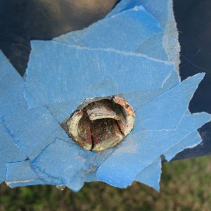 Old tube, section tapped down with cold chisel, after which I grabbed it with vise grips and pulled it out.
