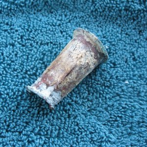 Old brass transom drain tube, removed.  As you can see, the sealant was scanty at best.