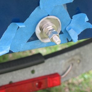 I temporarily moved on to another task because rain was in the forecast.  I didn't want water to get into the core, so I used butyl tape and some large fender washers to make a tightenable plug.