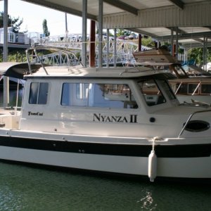 Media 'Finally put our name on - "Nyanza II" - also shows our new slip.' in album 'Our new boat!'