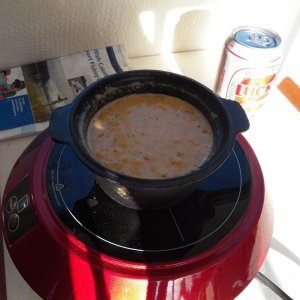 Media 'I found a tiny Dutch oven at a thrift store.  Here I have filled it with cornbread batter and it's ready to bake.  The induction burner heats up the cast iron Dutch oven just like it was inside a regular oven.' in album 'This is a $45 induction cooker connected to a 1000W pure sine wave inverter.  The lowest setting is a nice simmer and the highest setting could fry (which I never do).  It doesn't trip the inverter.  It seems to be about a quick as a microwave and no open flame.'