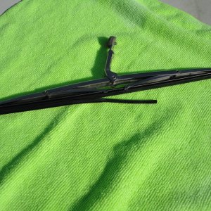 Old bad wiper blade in holder