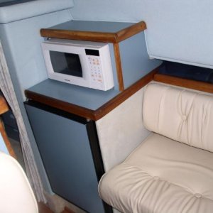 Microwave can fit in top cabinet