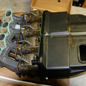 Intake, Carbs, Silencer-from-back-side:
The intake gasket and all carb gaskets should be replaced.