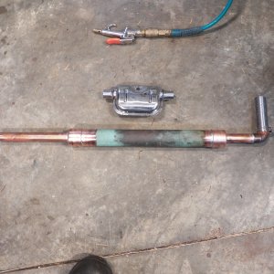Media 'I bought a stainless muffler only to find out that it is not for inhabited space.  It is spot welded and not airtight, so it will not work for my application.  I made one out of some scrap copper plumbing pipe.  It is a glass pack style of muffler.' in album 'This new hatch is the proposed location for an Espar D2 Diesel heater. The heater is a little smaller than a football, but on a CD 16 even that amount of room is hard to find. It appeared that an access hatch in the cockpit panel would provide enough room. These hatches were available in "Seafoam," a color that some websites said was discontinued. It matches pretty good.'