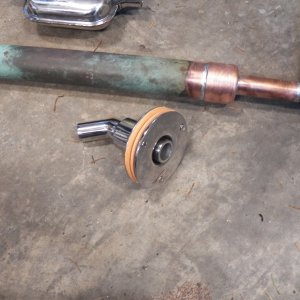 I also bought an exhaust through hull with a 45 degree bend.  That allows me to point it up to keep rain and spray out of the exhaust pipe.
