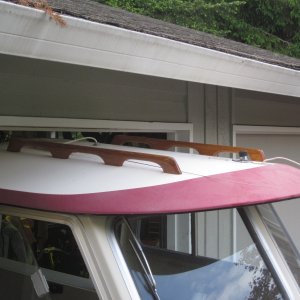 Barely fits into 6'11" high garage door on a EZ Loader 14-18 2100 Roller trailer, but had to remove antennas from roof. Later remounted them elsewhere.