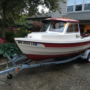 One of last photos before selling in 2017, but showing the 1990 Angler on a 2013 EZ Loader 14-18 2100 Roller trailer, fitting (just barely) under the 6'11" high garage door opening.