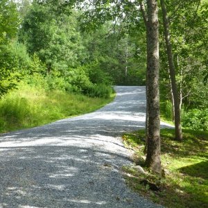After coming down this driveway I had to launch here. I don't think pulling the boat back up around the corners would have been possible even with four wheel drive as it is gravel and steeper than this picture looks the switchback is at the top of the picture and goes sharply to the left. I think a two wheel drive truck might have trouble getting out with out a boat and trailer