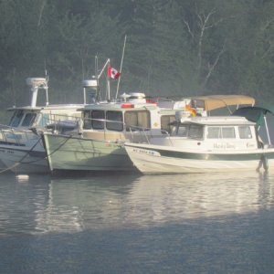 Hunky Dory, Illusions, Widget, and Kingfisher rafted on a mooring