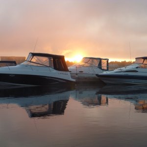 The sun coming up on the Saint John river at the St Regis Wharf Marina in Fredericton