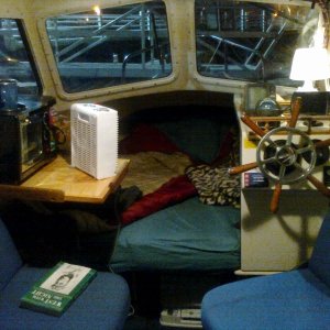 Set for the night.  Note how bright it is outside the boat.  This is not due to daylight, the marina has big lights at the seawall.  Curtains are first order of business today.