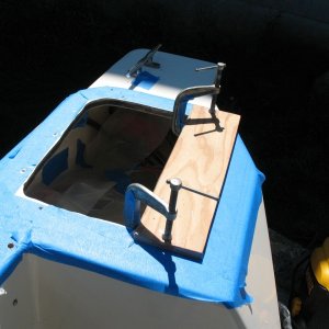 Testing fit of forming board, clamps.  Clamps have blue tape on them to ward off epoxy. Forming board covered in clear packing tape.