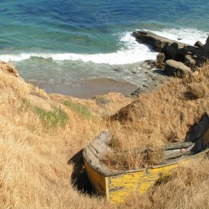 A very old rowboat buried in the hillside, couldn't figure out how it got here, up so high from the water.