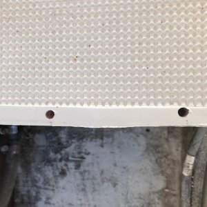 Drilled screw holes over-sized.  It's balsa not glass.