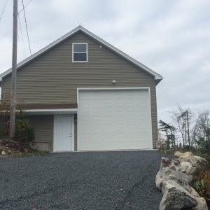 Media 'New Garage. (view from the east). Man Door and Boat access. Boat door is 14' high and 12' wide.' in album 'New Garage. (view from the east). Man Door and Boat access. Boat door is 14' high and 12' wide.'