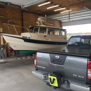 Media 'Plenty of room nor now. Can store my car, outboards, utility trailer, and dinghy trailer, with still room for a workshop.' in album 'New Garage. (view from the east). Man Door and Boat access. Boat door is 14' high and 12' wide.'