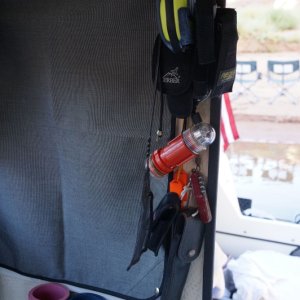 By the door--PLB, multi-tools, knives, stobe whistle etc