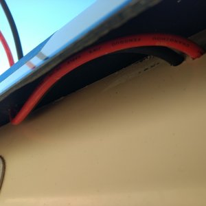 Here are the cables running up under the roof overhang.