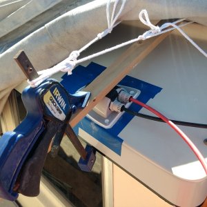 The gland had some screw holes for mounting but not wanting to penetrate the cabin roof some 3M 5200 and funky clamping should do the trick.