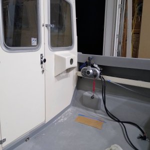 Door is finished with window and lock installed. Steering console ready for baystar system.