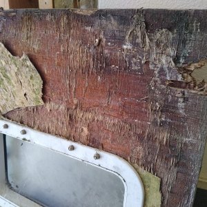 Door is toast. I will be building a new fiberglass one. (Pictured is the bottom of the door).