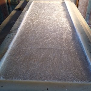 The beginning of my new fiberglass door. Very simple MDF mold. Modeling clay radiuses in corners,  Duratec surfacing primer sprayed. Followed by Lite polishing, 4 coats of wax release, 2 coats of PVA.