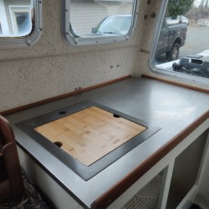 New S.S. Countertop, new deep sink with flush cutting board.