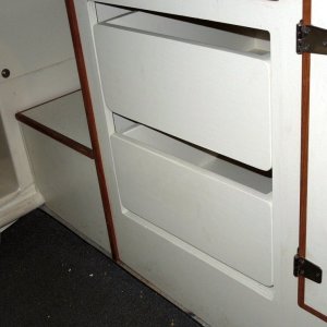 Media 'Used a good latex satin match tinted to surface of cabin plywood finish.' in album 'Area under helm seat where refrigerator was located.'