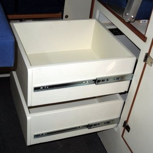 Media 'Drawers made from ?in veneer finished plywood painted with tint matched latex paint.  Assembled with glue and pneumatic brad nail gun.' in album 'Area under helm seat where refrigerator was located.'
