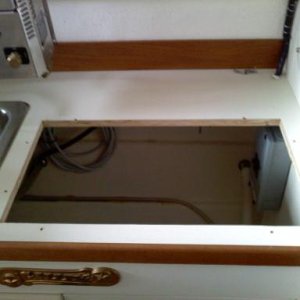 03/15/2010, removed alcohol stove, will replace it with a two burner kenyon electric cook top stove, 20 amp, 110 volt system