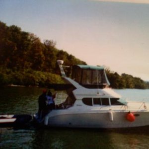 312 silverton "Livin' The Dream"
towing our dinghy, at anchor waiting to lock thru. we sold this boat and purchased the 2000 carver